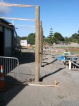 Poles upright and concreted in position